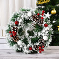 Snow Frosted Pinecone Christmas Wreath with Red Berries